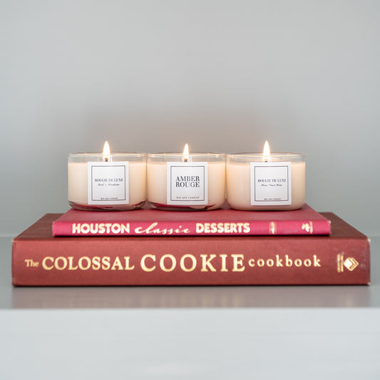 Dessert cookbooks stacked below lit Sample Trio