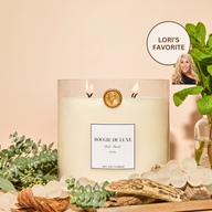 Big Ass Luxuries Palo Santo candle, organic coconut soy wax infused with peppermint leaf, eucalyptus, cedarwood, and sandalwood for a purifying, grounding scent.