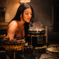 Woman Blowing Smoke Out Candle 