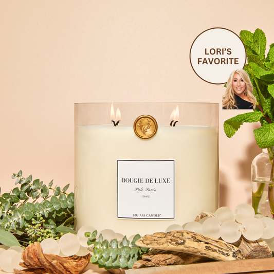 Big Ass Luxuries Palo Santo candle, organic coconut soy wax infused with peppermint leaf, eucalyptus, cedarwood, and sandalwood for a purifying, grounding scent.
